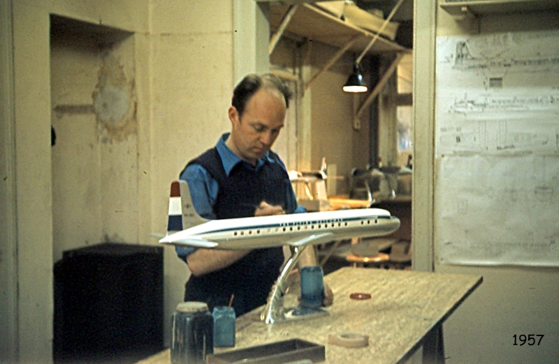 An employee hand painting the model in 1957